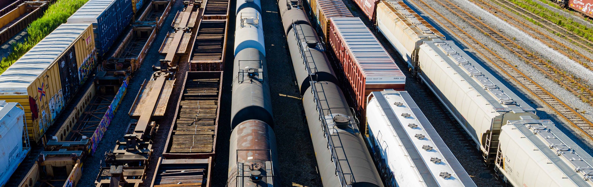 Chemicals transported by rail to transload facilities Line of train cars in a train yard ready for chemicals transported by rail