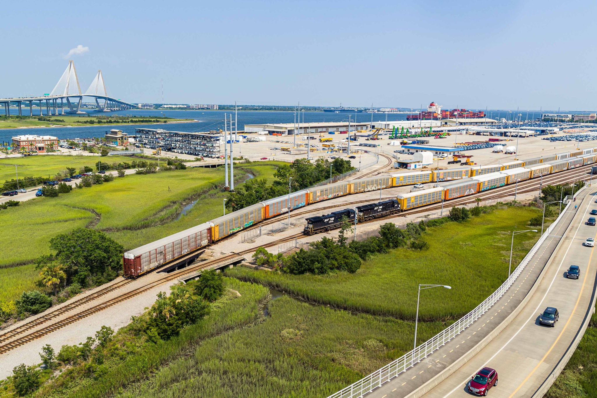 A far away shot of Norfolk Southern’s automobile carrier trains leaving the station and ready to provide automotive rail shipping service.